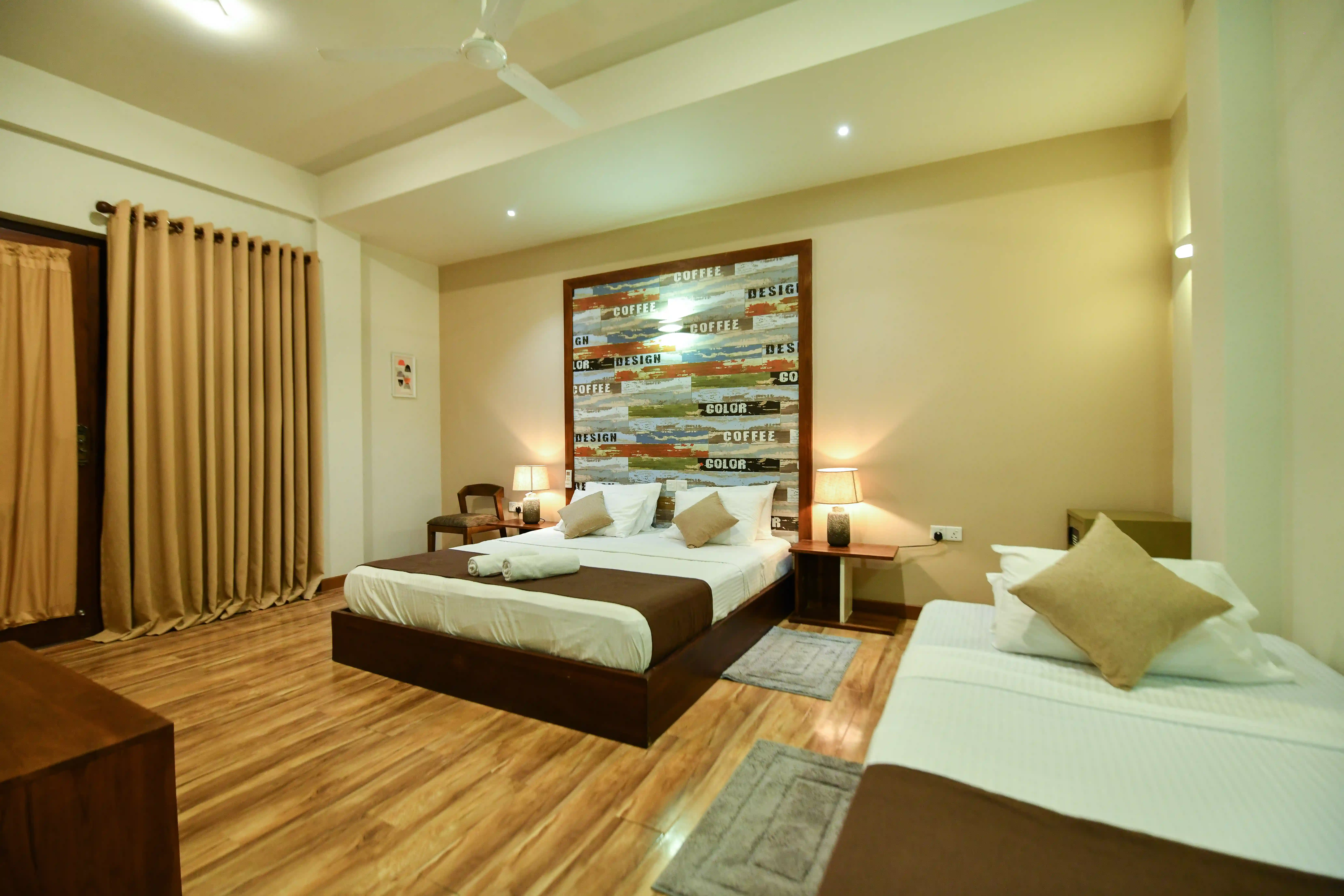 Deluxe Triple room at Hiriketiya Beach Resort with modern amenities in Hiriketiya