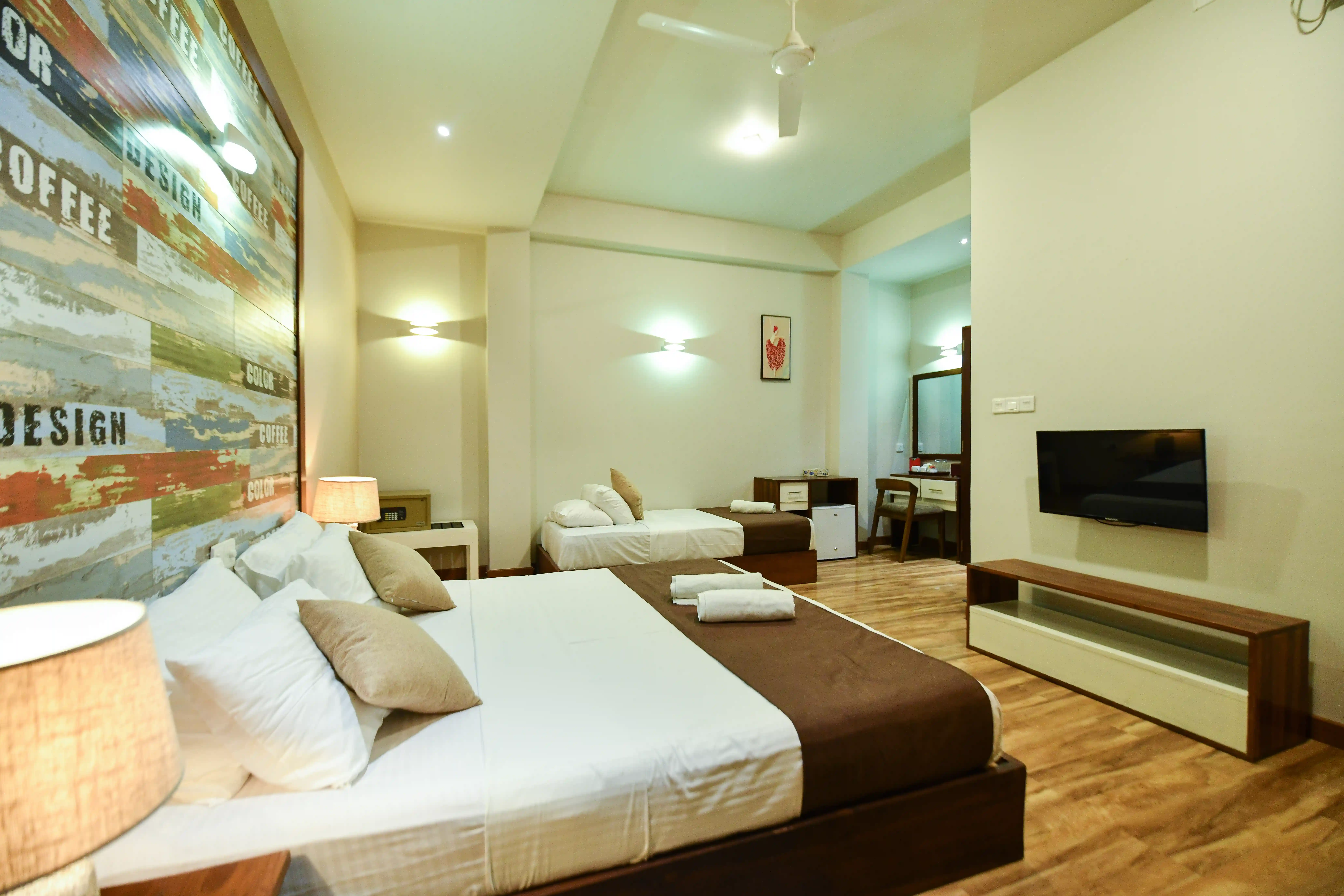 Deluxe Triple room at Hiriketiya Beach Resort with modern amenities in Hiriketiya