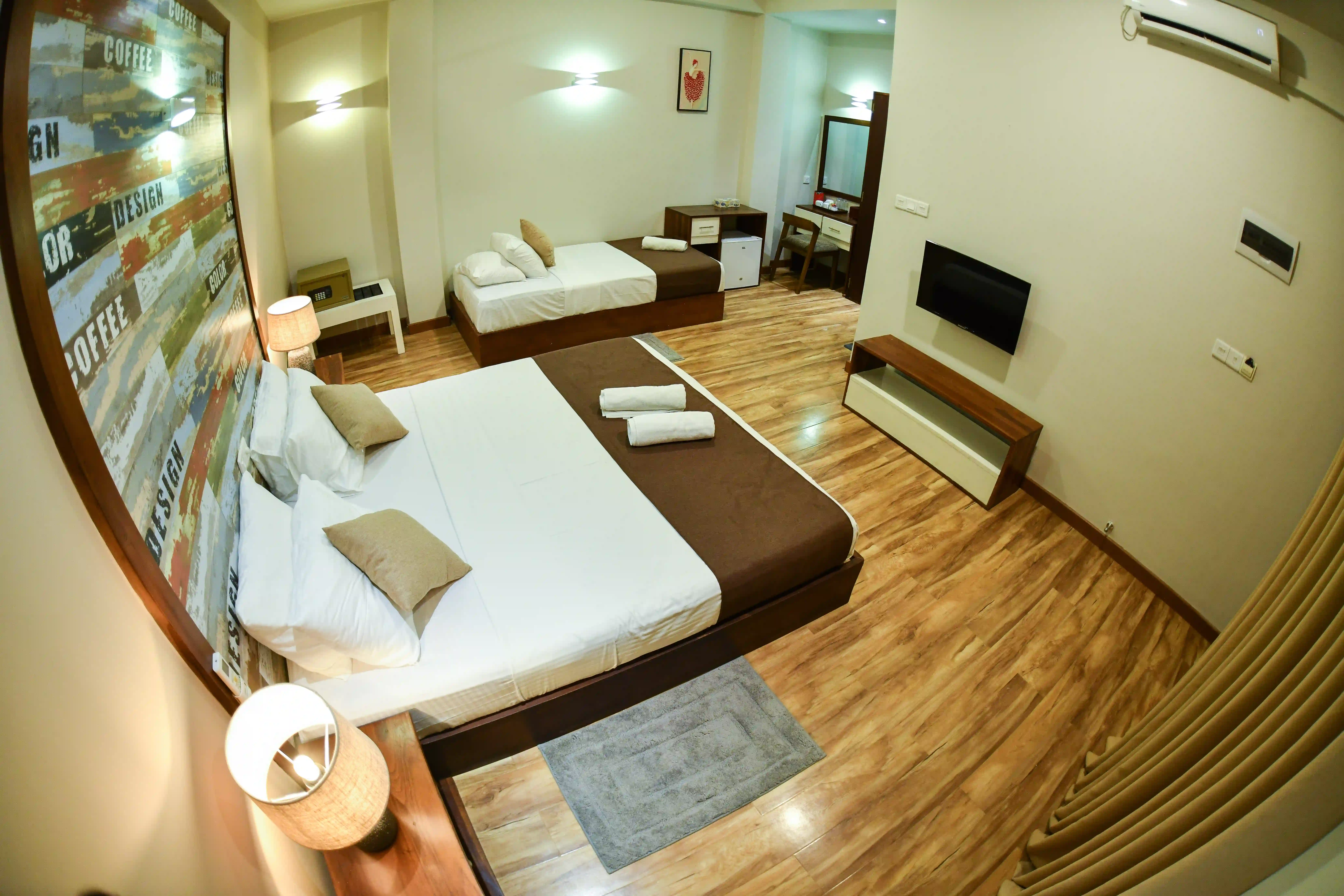 Deluxe Triple room at Hiriketiya Beach Resort with modern amenities in Hiriketiya