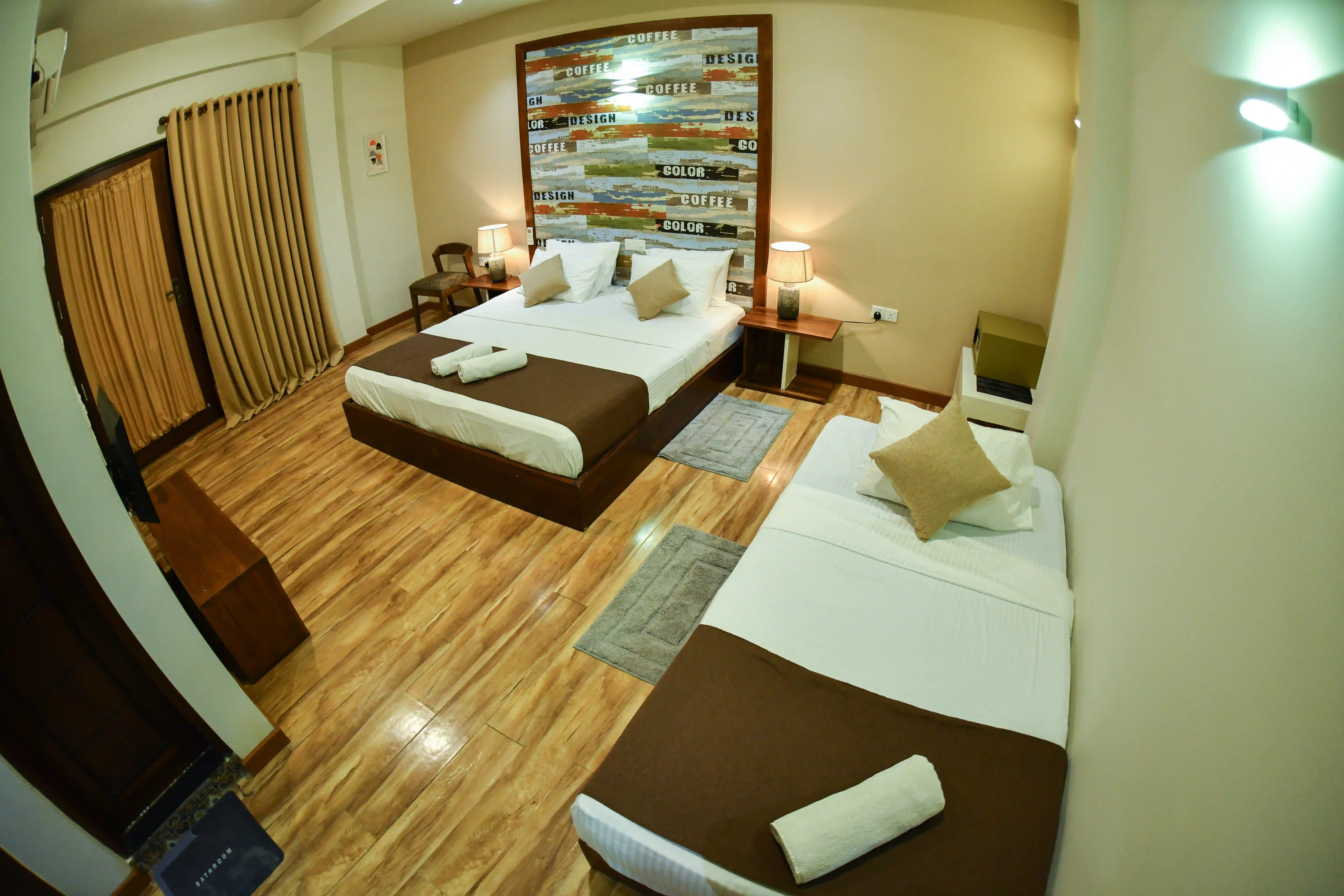 Deluxe Triple room at Hiriketiya Beach Resort with modern amenities in Hiriketiya
