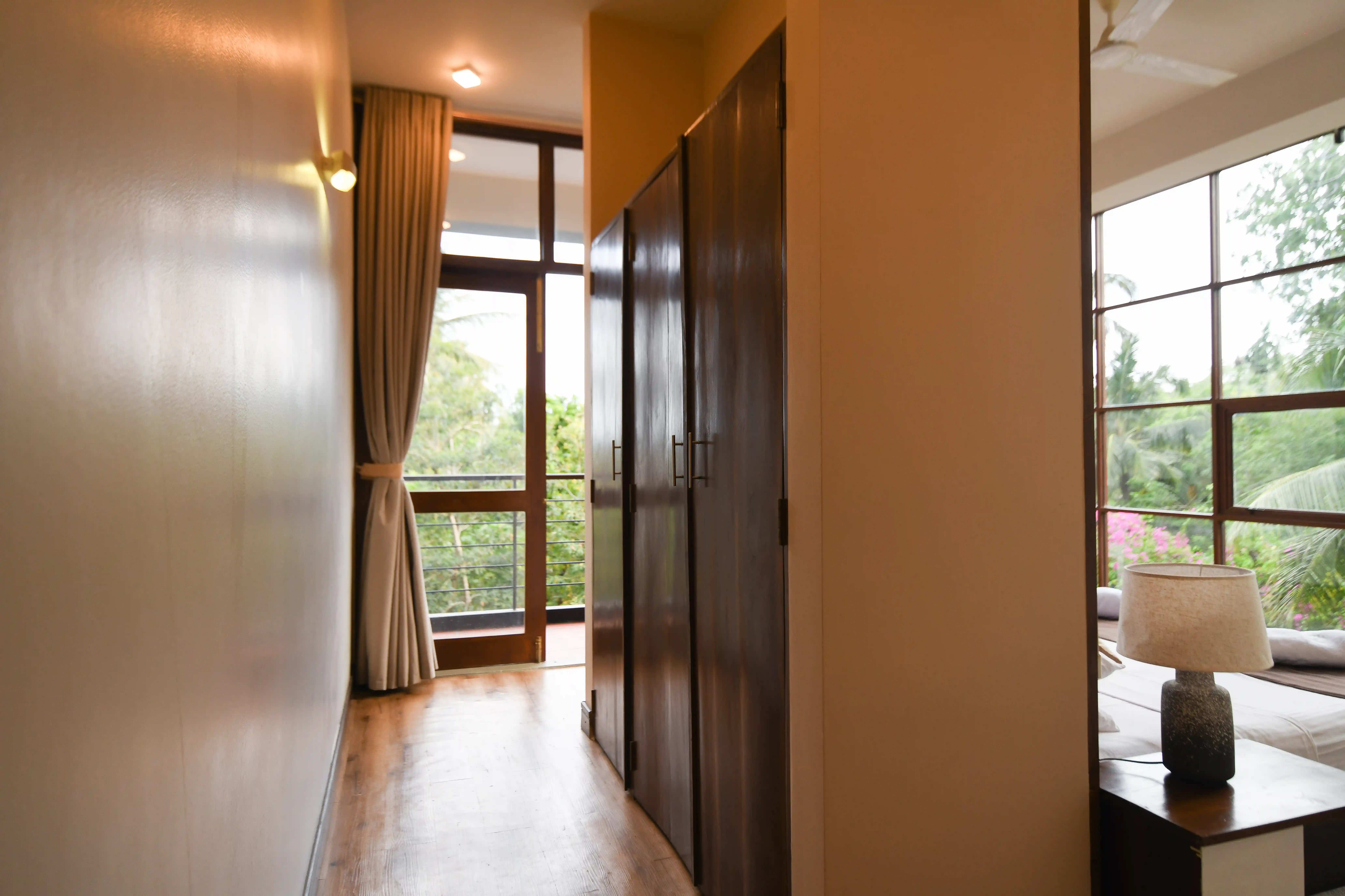 Spacious room corridor with wardrobe and balcony view at Hiriketiya Beach Resort for comfortable Hiriketiya accommodation