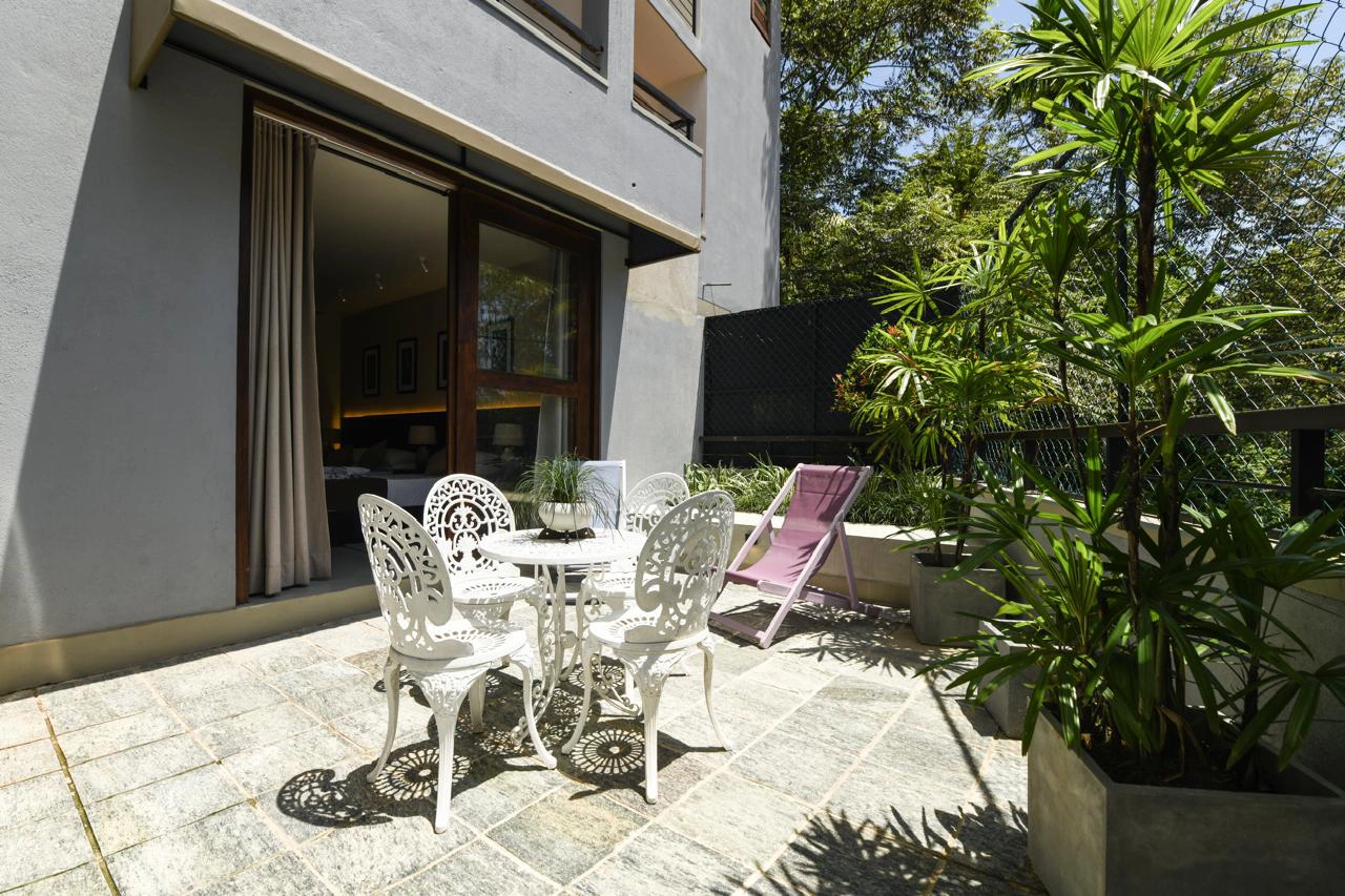 Hiriketiya accommodation garden terrace seating at Hiriketiya Beach Resort