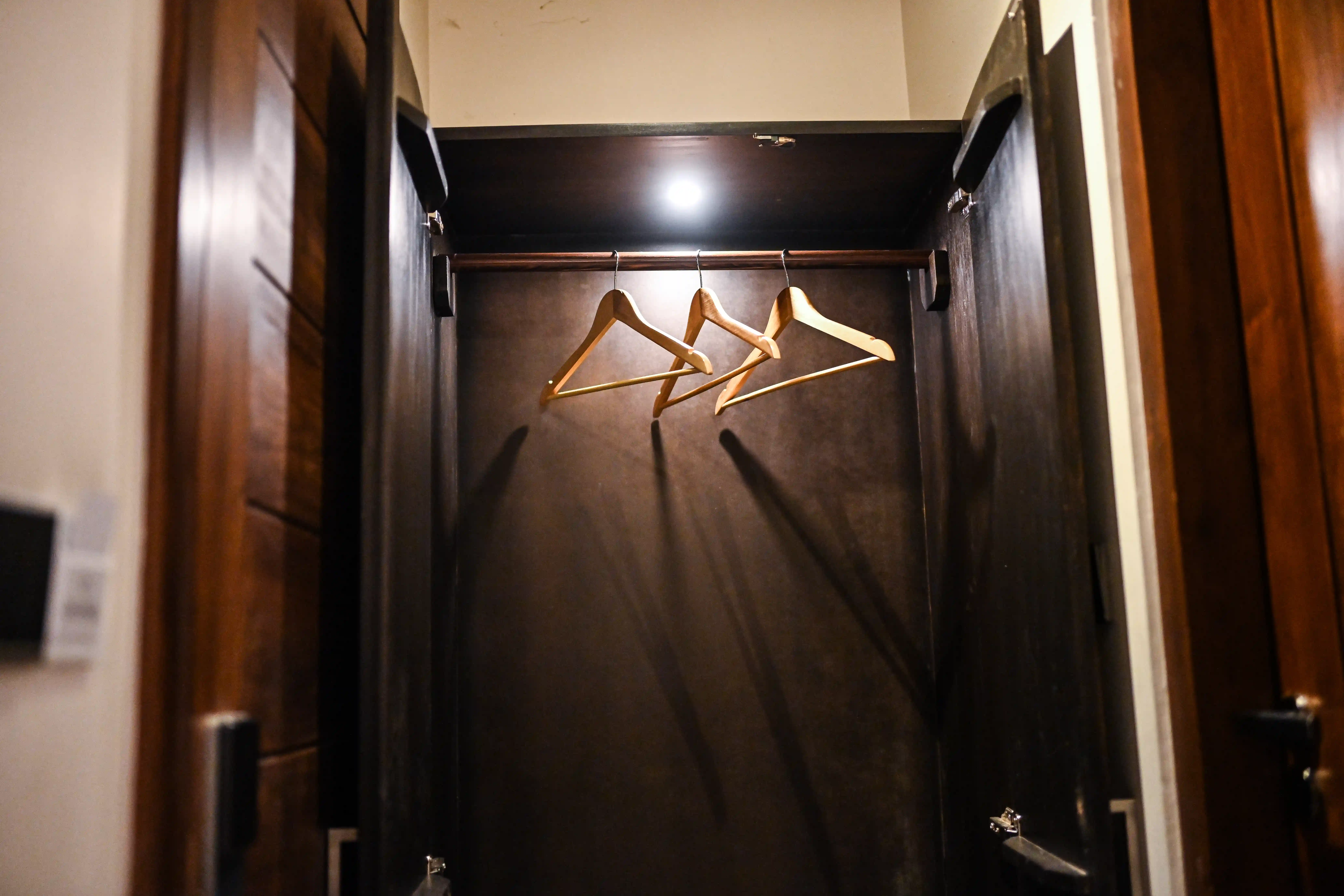 Wardrobe with hangers in modern room at Hiriketiya Beach Resort for comfortable Hiriketiya accommodation