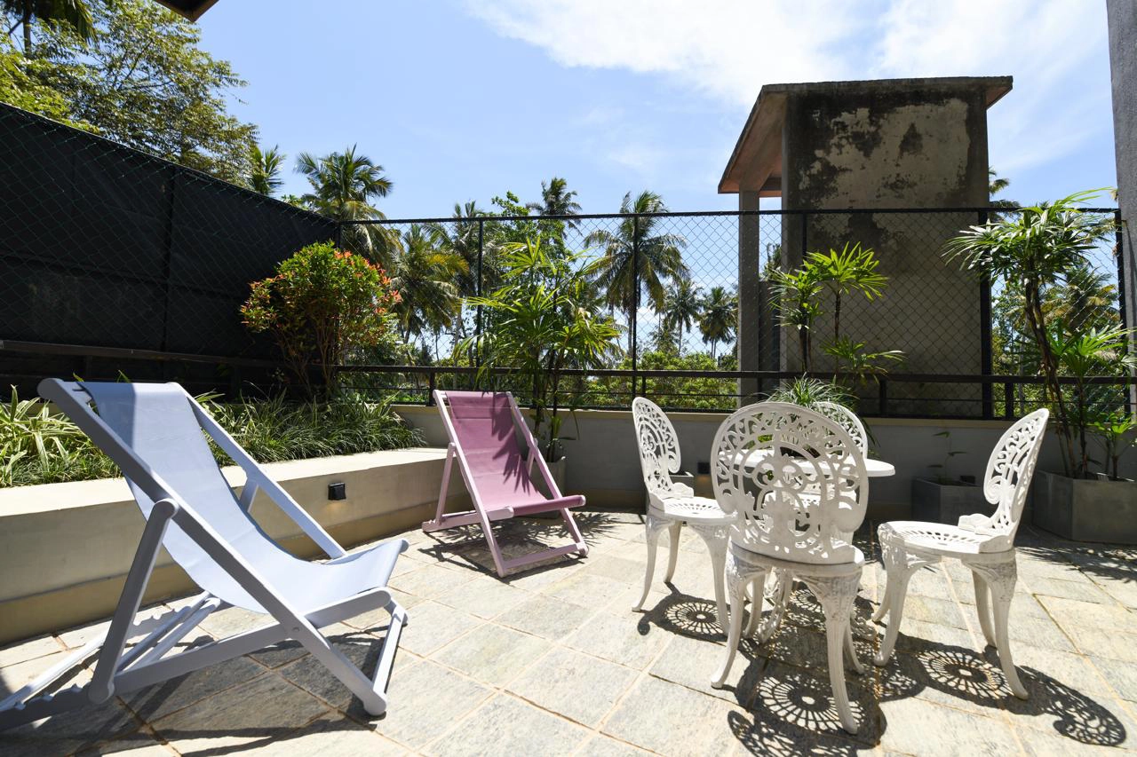Hiriketiya accommodation garden terrace seating at Hiriketiya Beach Resort