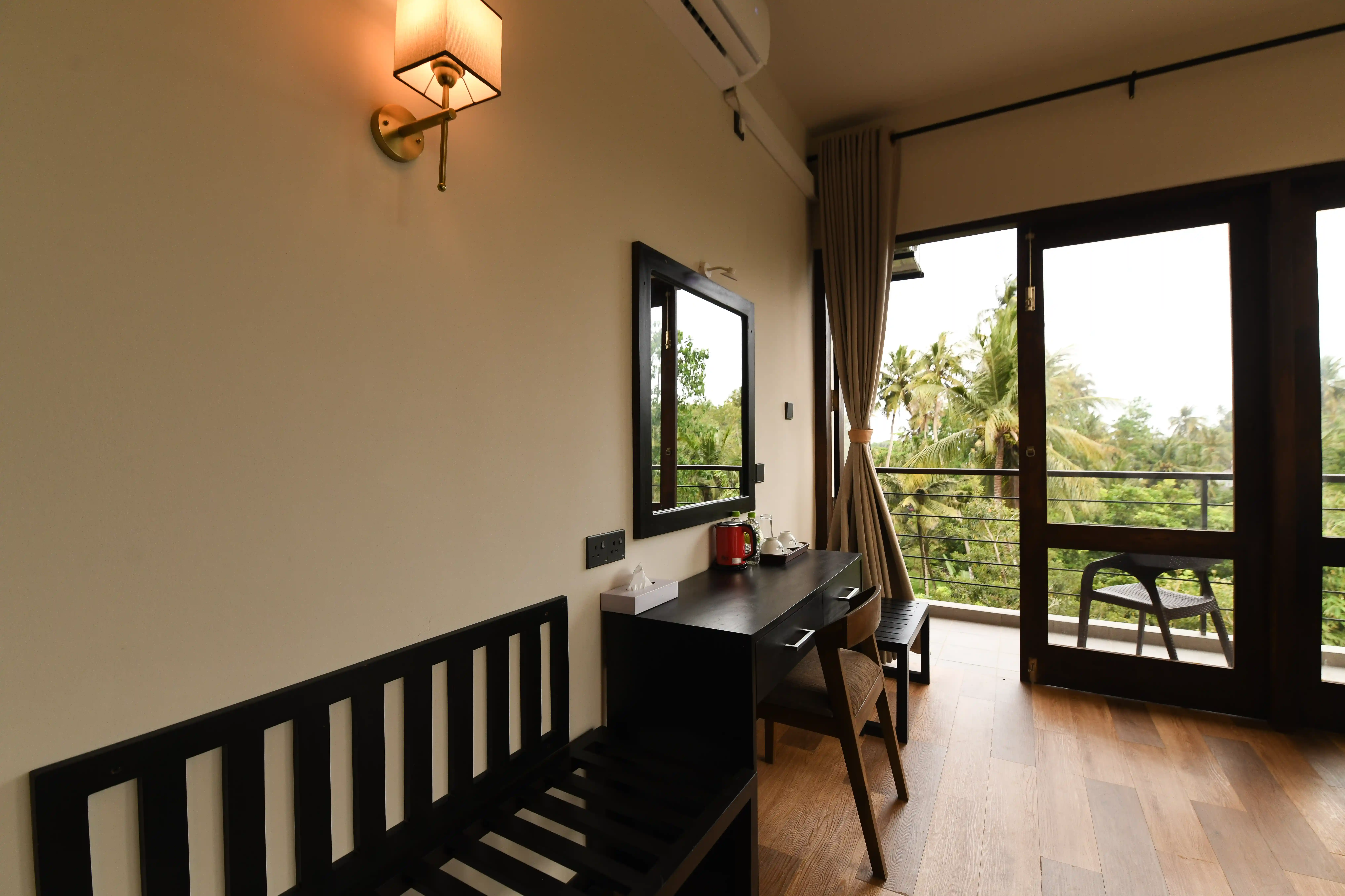 Modern room with balcony and garden view at Hiriketiya Beach Resort for comfortable Hiriketiya accommodation