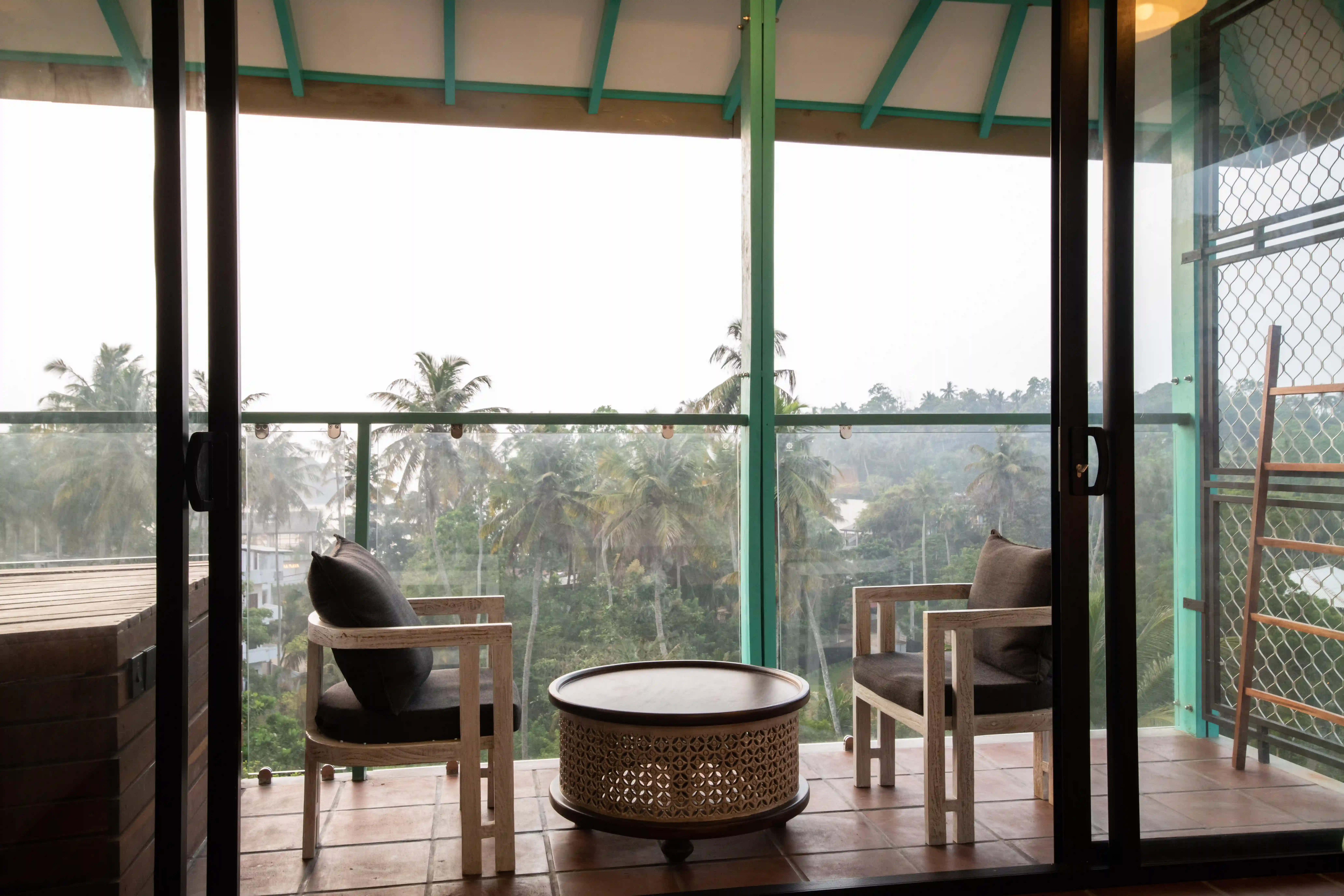 Private balcony seating area with table at Hiriketiya Beach Resort for comfortable Hiriketiya accommodation