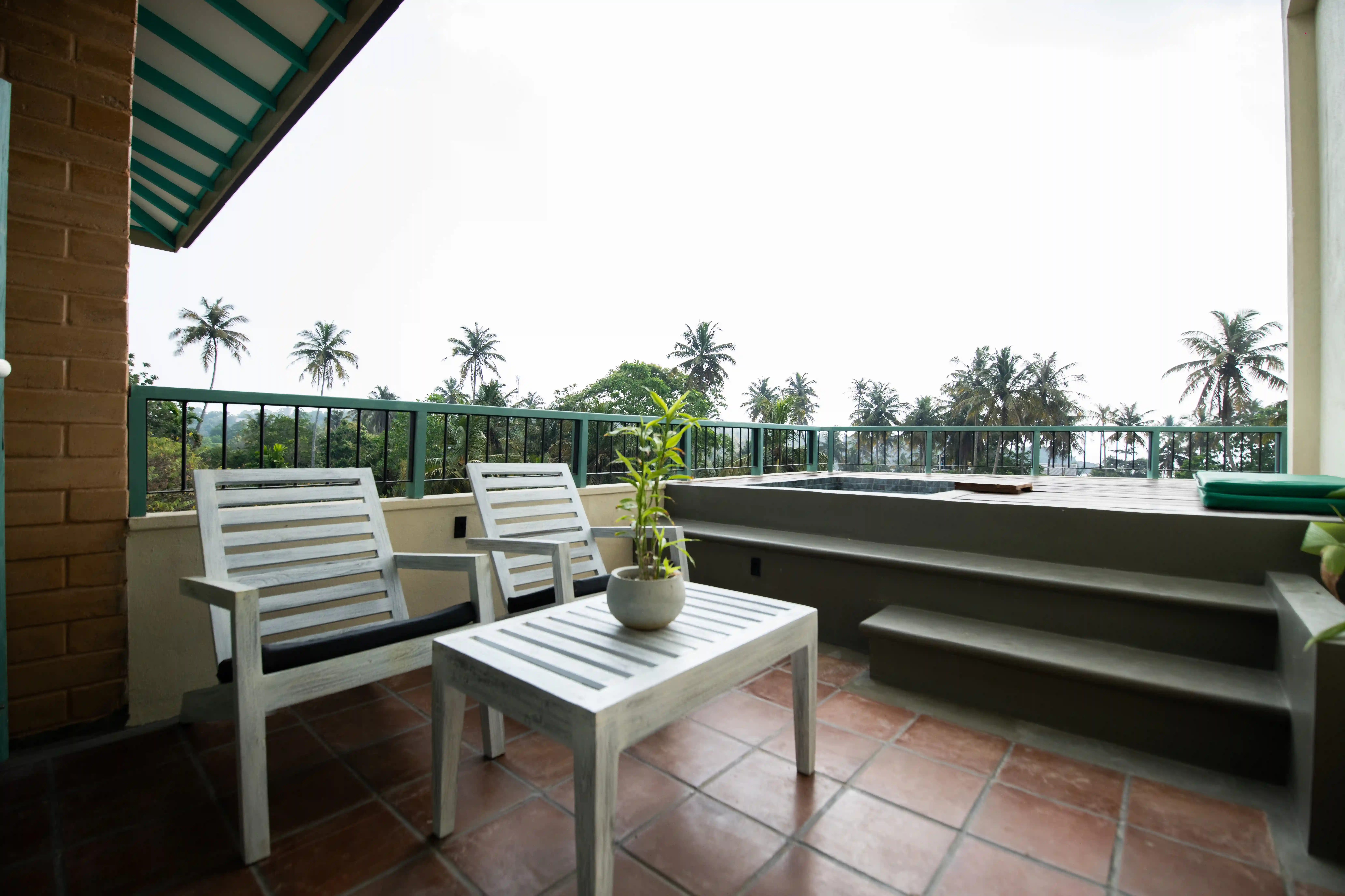 Private balcony at Hiriketiya accommodation with outdoor seating at Hiriketiya Beach Resort