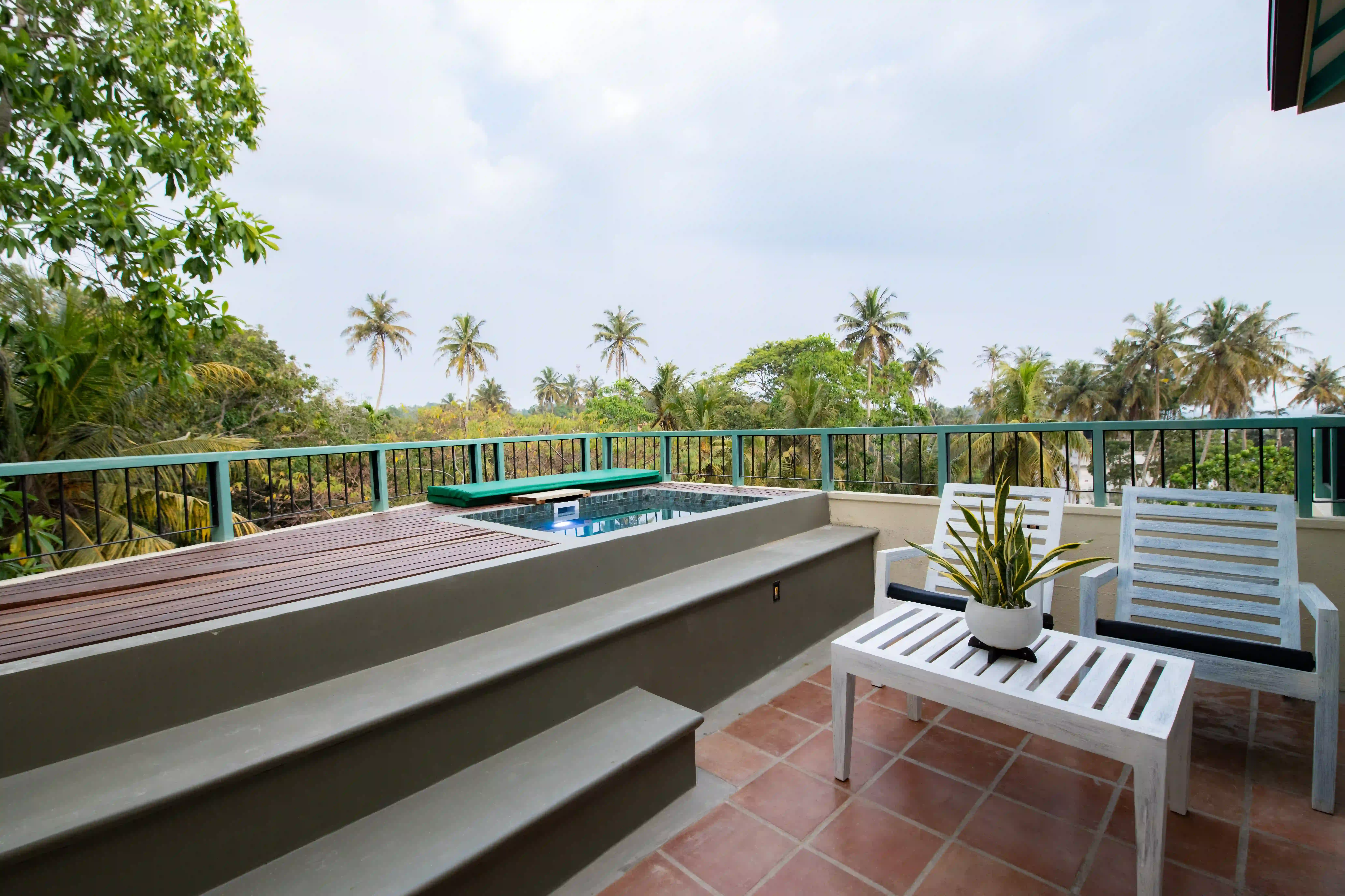 Private balcony at Hiriketiya accommodation with outdoor seating at Hiriketiya Beach Resort