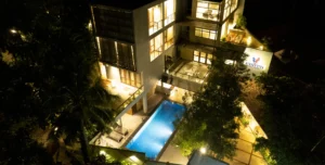 Night view of Hiriketiya Beach Resort with swimming pool and modern exterior for Hiriketiya accommodation